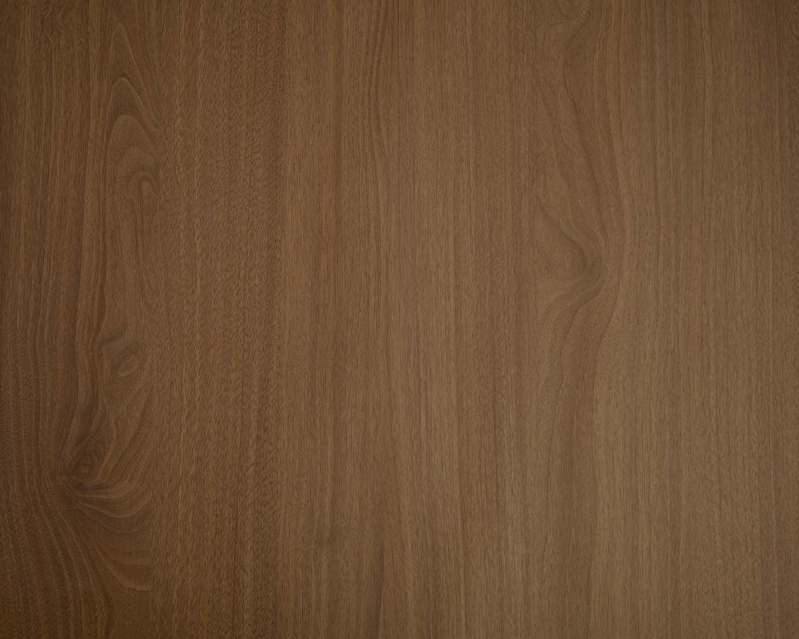 Rich natural walnut wood grain peel and stick finish in soft light