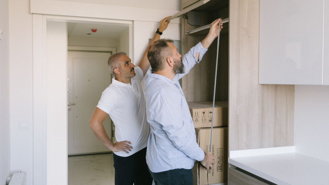 Measuring a smooth cabinet door before calculating how much vinyl wrap is needed