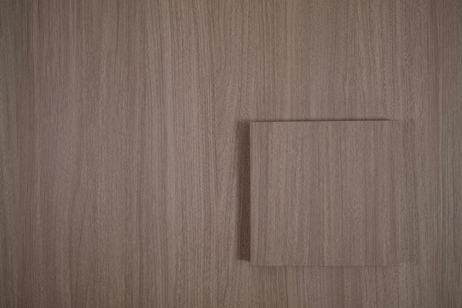 Mink Walnut tile sample on matching wood grain vinyl wrap