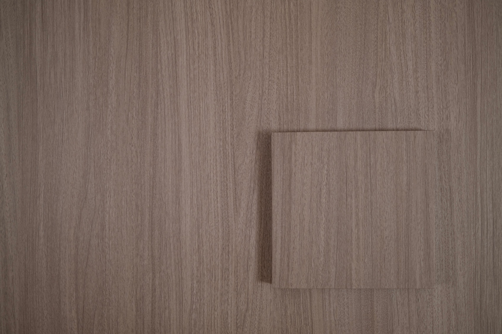 Mink Walnut tile sample on matching wood grain vinyl wrap