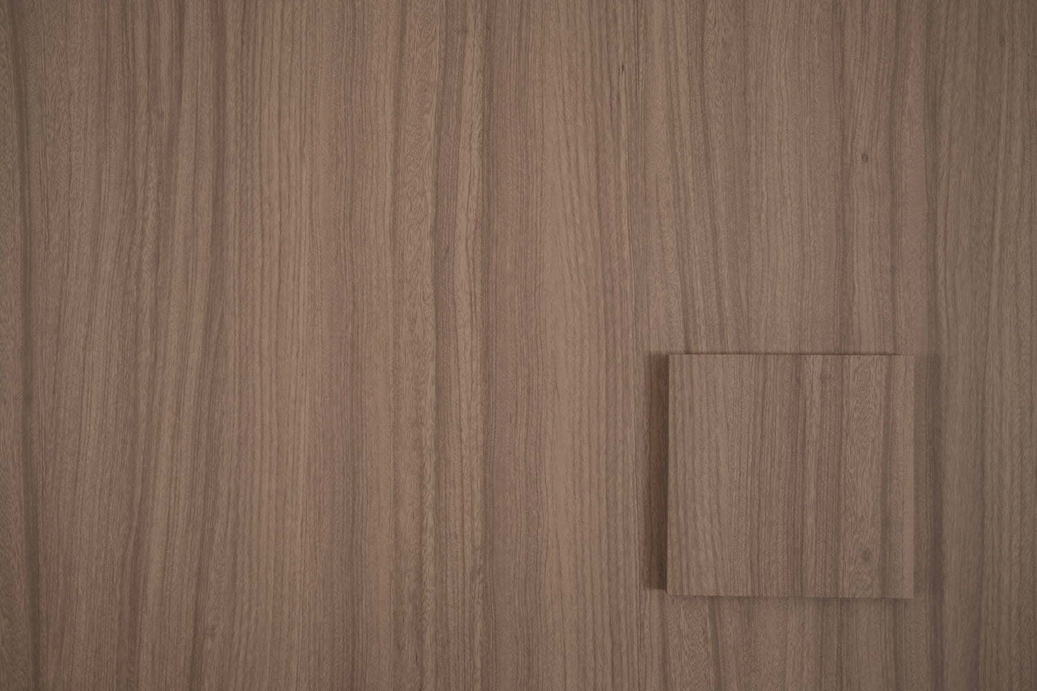 Dune Oak tile sample on matching wood grain vinyl wrap