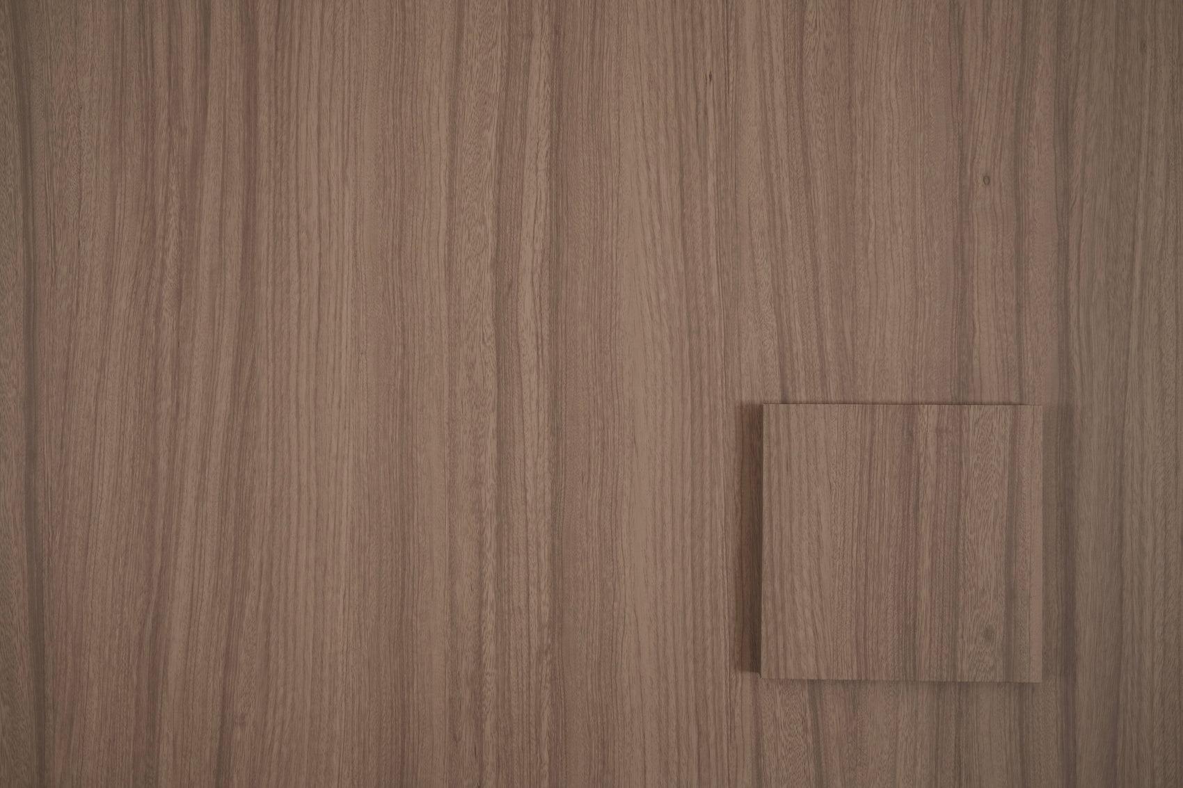 Dune Oak tile sample on matching wood grain vinyl wrap
