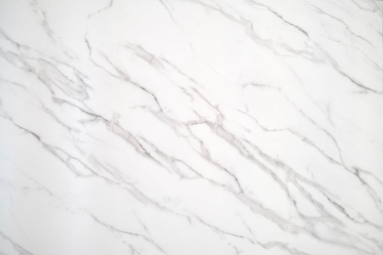 Calacatta White Marble vinyl wrap with an ivory-white surface and flowing grey veins, full surface view