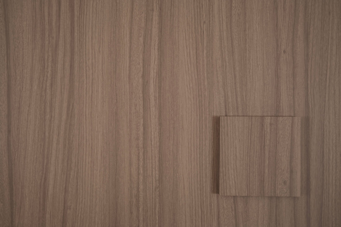 Dune Oak tile sample on matching wood grain vinyl wrap
