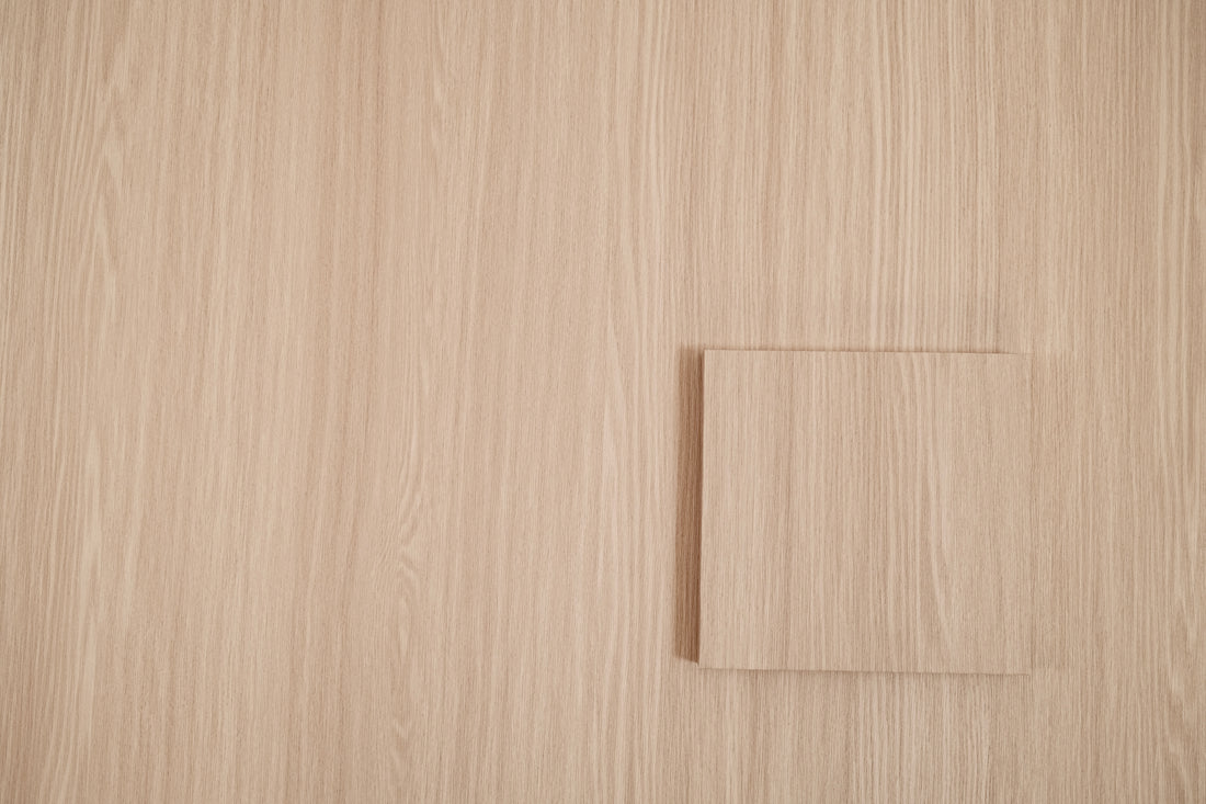 Linen Oak peel and stick vinyl wrap sample tile showing raised grain texture