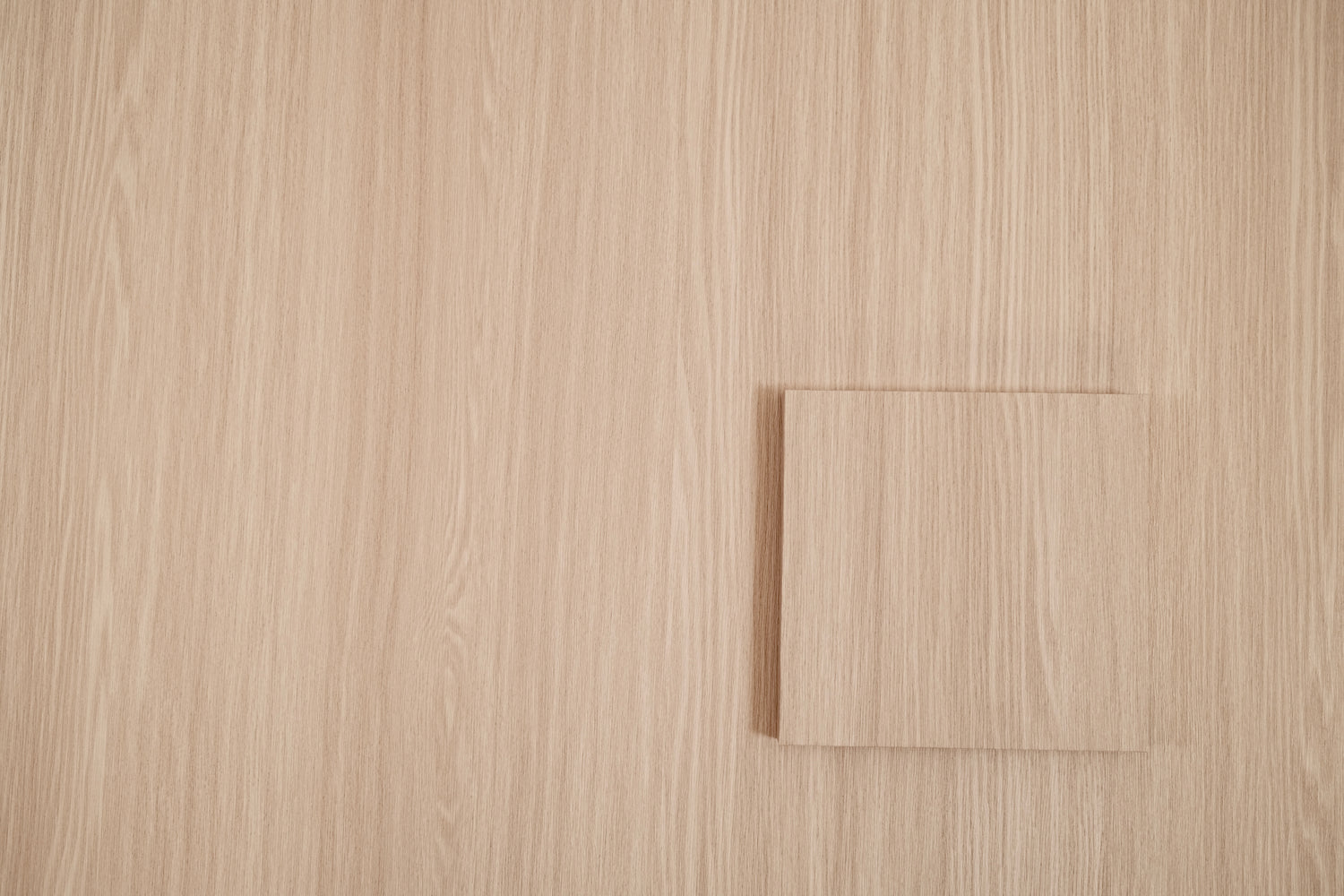 Linen Oak peel and stick vinyl wrap sample tile showing raised grain texture