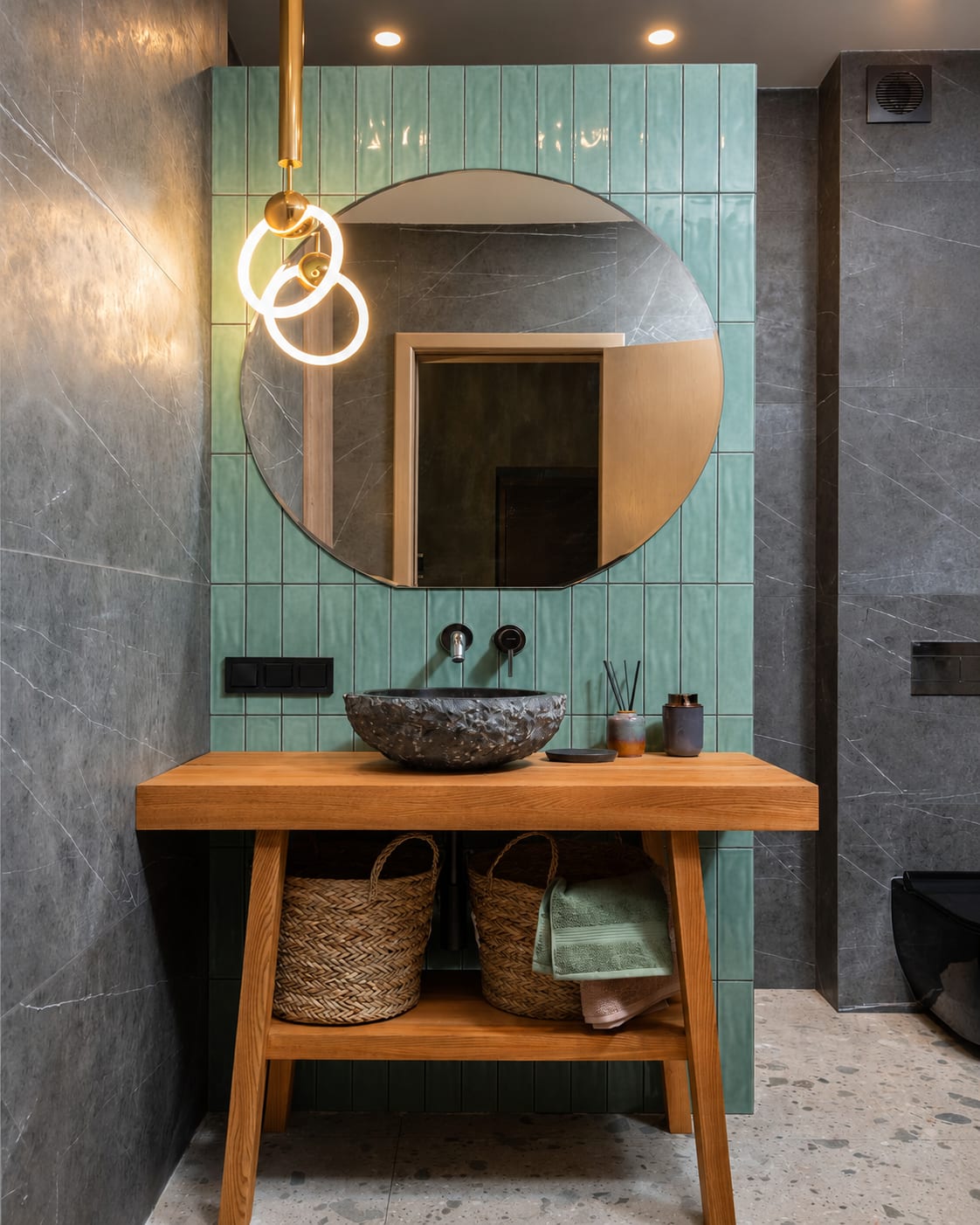 A bathroom with a green tile feature wall and an oak console vanity in Sereno Oak