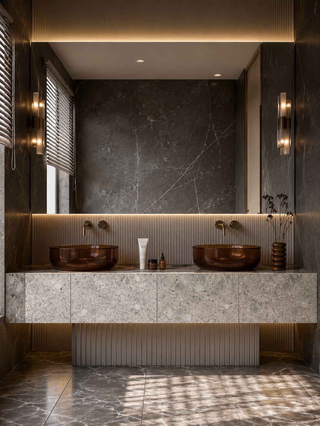 A double vanity with a fluted base wrapped in Ceppo di Gré stone and copper basins