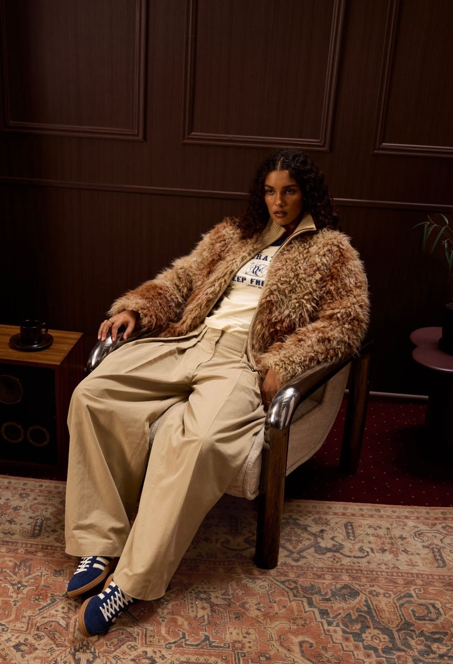 Model seated in the Hype DC Speziale campaign set finished with dark French Chestnut wall panels
