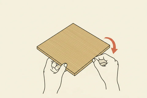 Illustration of two hands folding film around the edge of a small practice offcut